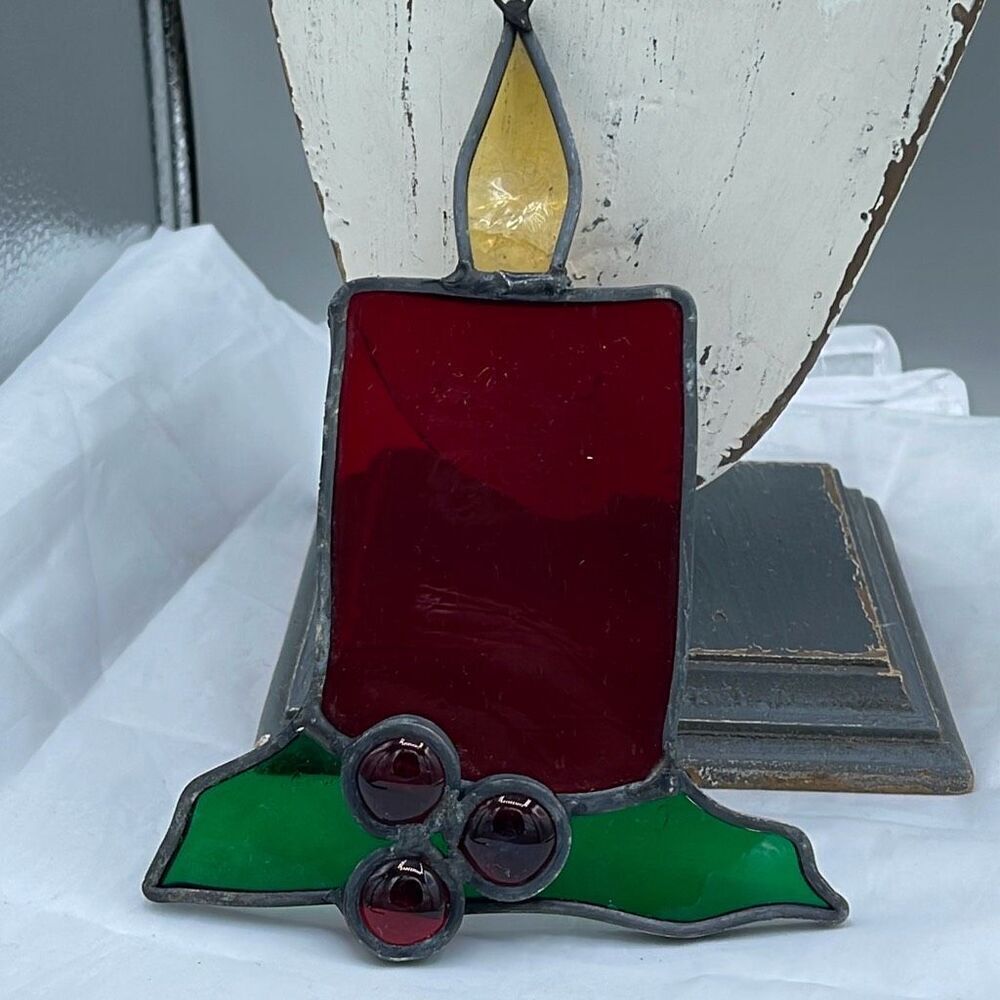 Vintage Christmas stained glass candle with holly sun catcher.